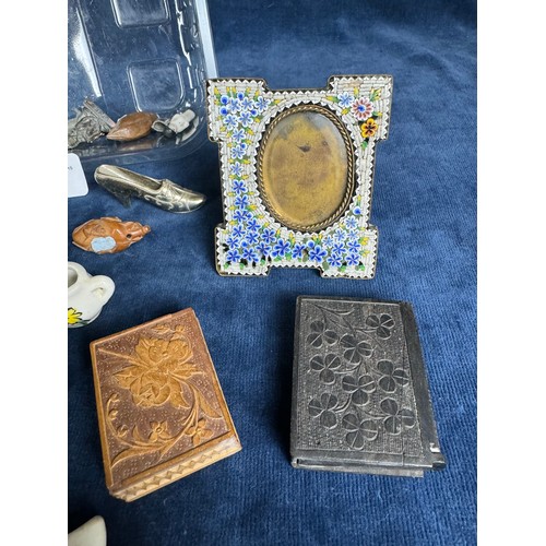 292 - A tub of miniature items including a decorative photo frame, small carved box, wooden match case, sh... 