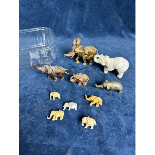 297 - A tub containing various figures of elephants made from metal and China etc.