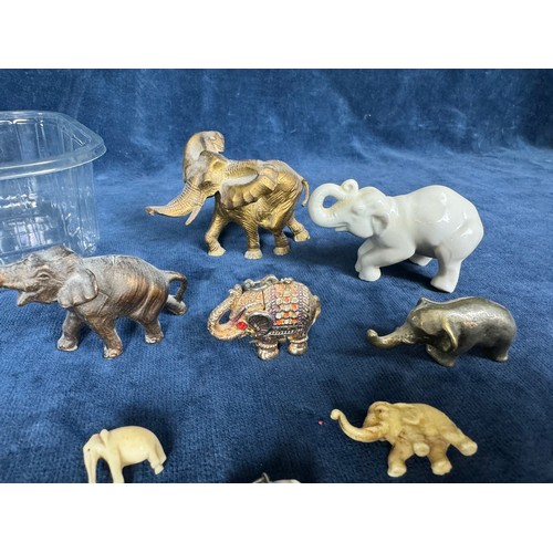 297 - A tub containing various figures of elephants made from metal and China etc.