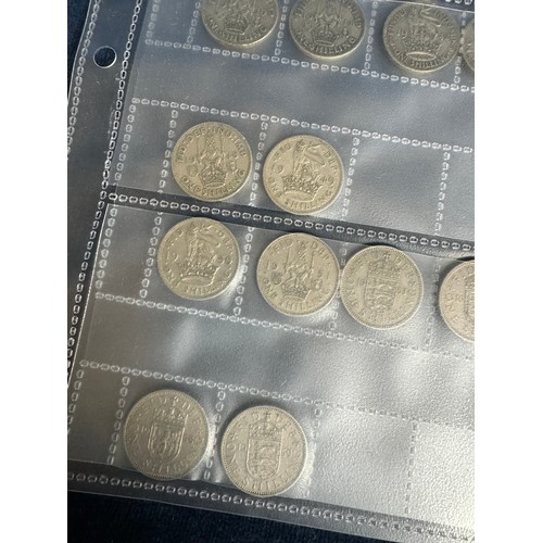 316 - A sheet containing 35 one shilling coins dating 1920 to 1959