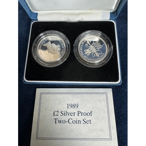 319 - A Royal Mint silver proof £2 coin set, 1989,  and a Royal Mint silver commemorative £2 coin 