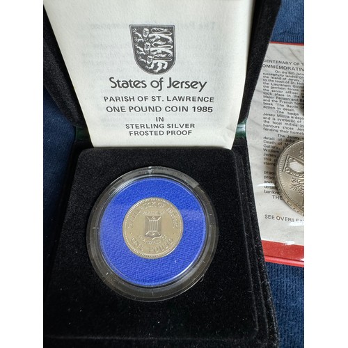 321 - A sterling silver 1985 States of Jersey, Parish of St Lawrence, £1 coin and a 