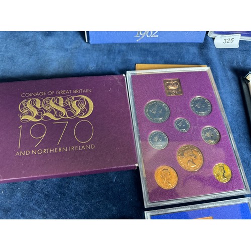 325 - 4 Royal Mint coin sets being 