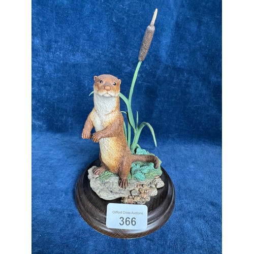 366 - A Country Artists figurine 'Otter Standing', CA498, on wooden base, designed by K. Sherwin.