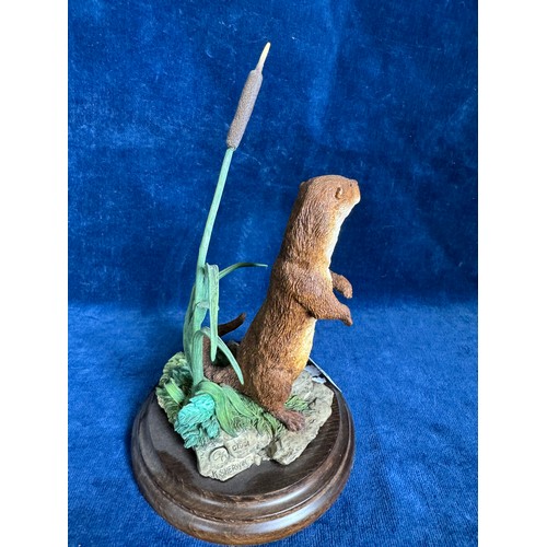 366 - A Country Artists figurine 'Otter Standing', CA498, on wooden base, designed by K. Sherwin.