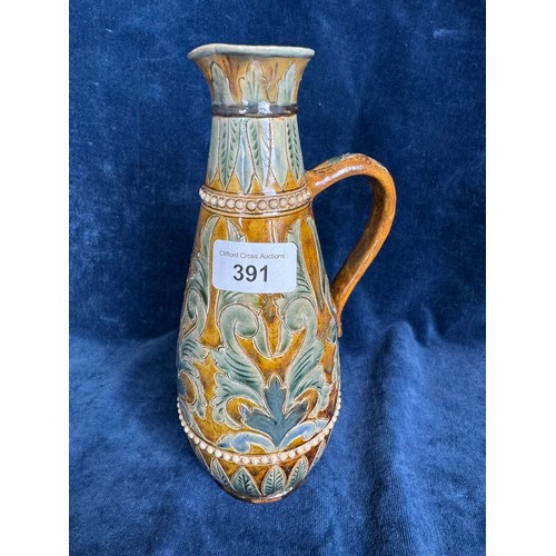 391 - A Royal Doulton Lambeth stoneware art nouveau ewer having brown and blue glaze with leaf and swirl d... 