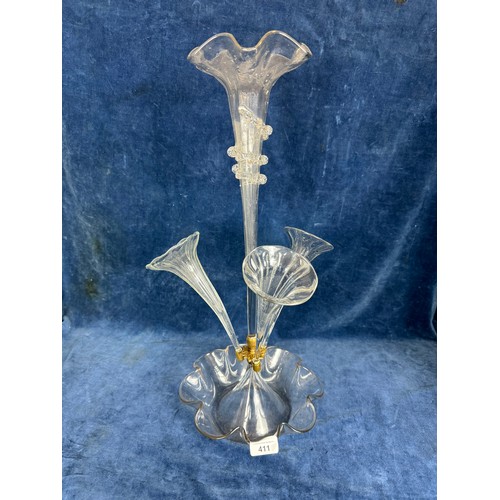 411 - A Victorian epergne with shaped glass base, three side trumpets and central vase, with brass fitting... 