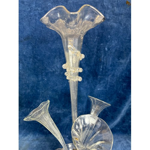 411 - A Victorian epergne with shaped glass base, three side trumpets and central vase, with brass fitting... 