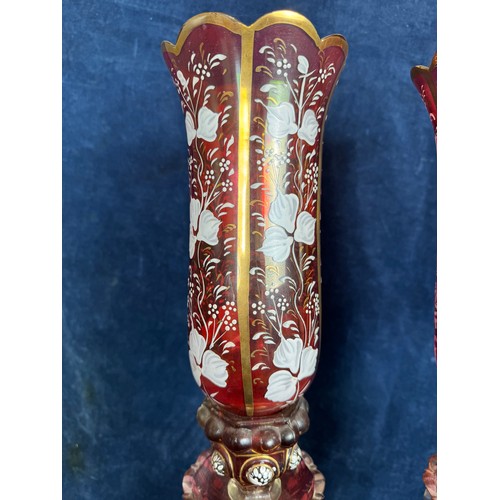 412 - A pair of Baccarat style antique candlesticks with hurricane shades, accented with hand-painted whit... 