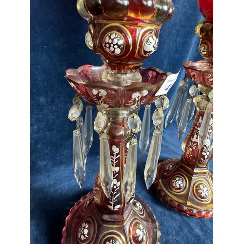 412 - A pair of Baccarat style antique candlesticks with hurricane shades, accented with hand-painted whit... 