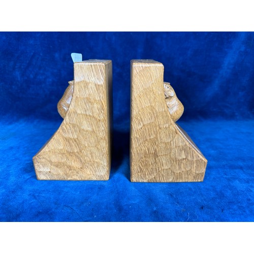 447 - A pair of handcarved solid oak, light fume, bookends by Robert 