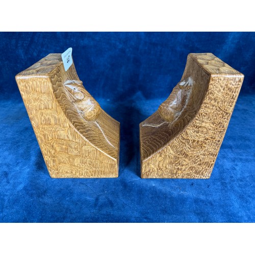 447 - A pair of handcarved solid oak, light fume, bookends by Robert 