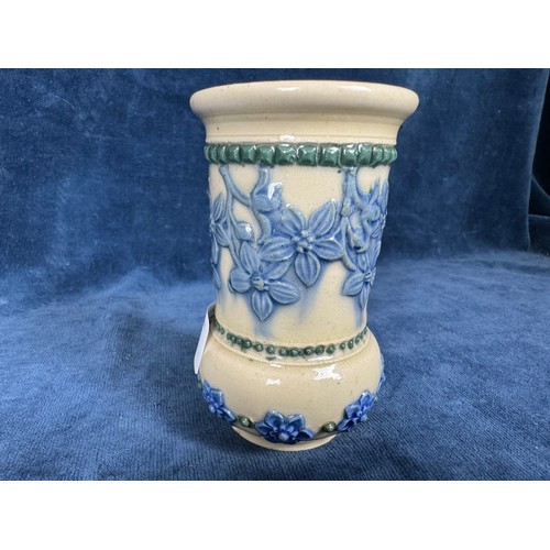 485 - A Royal Doulton Lambeth stoneware glazed vase having beige ground and blue relief floral decoration ... 