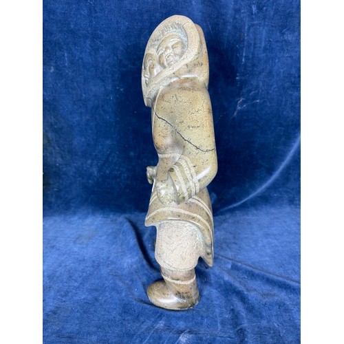 599 - An unusual carved stone figure by Eskimo art, Canada, depicting a
female Inuit character in traditio... 