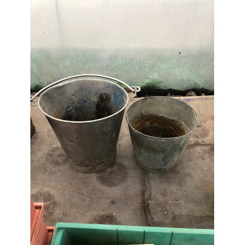 93 - A stainless steel bucket and a galvanised bucket