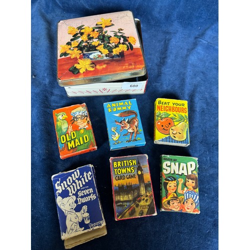 680 - A vintage tin containing 6 sets of vintage card games including 