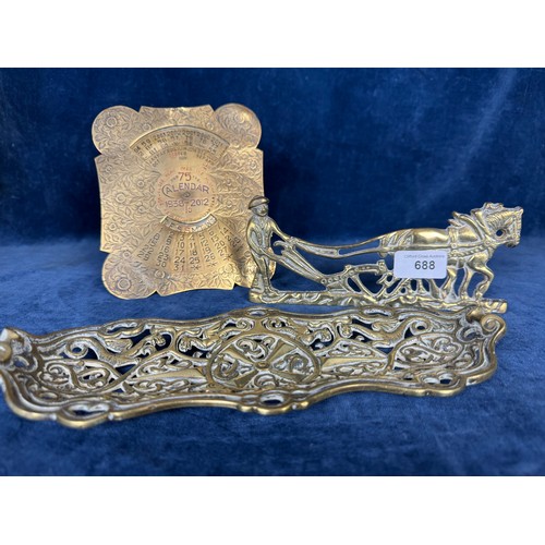 688 - A brass calendar for 1938 - 2012, a pierced brass dish and a brass horse and cart figure