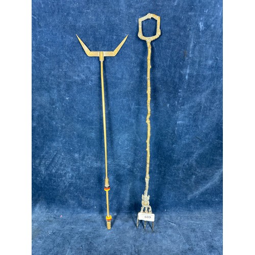 689 - Two brass toasting forks, one with a figure of the Lincolnshire Imp