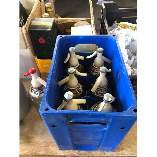 437 - A crate of 6 Schweppes Soda Water Syphons and an Adcocks Syphon