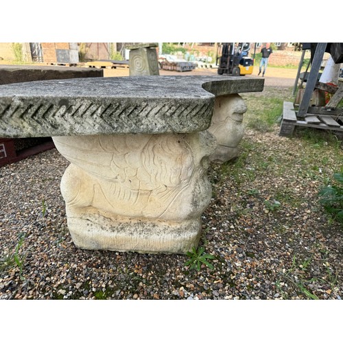3 - A stone garden table, diameter 114.5cm, with 2 curved benches.