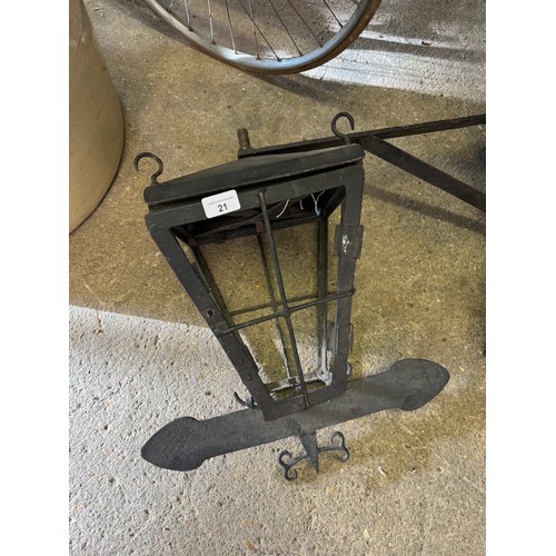 21 - A Blacksmith forged exterior lamp with corner bracket and weather vane arrows.