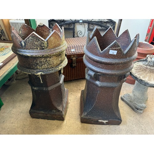 36 - A pair of terracotta chimney pots on square base with crown finials, 78cm tall x 32.5cm diameter.