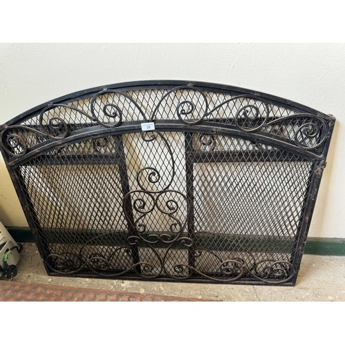 38 - An ornate wrought iron fire screen with 2 return panels.  99.9cm wide x 76cm tall, return panels 40c... 