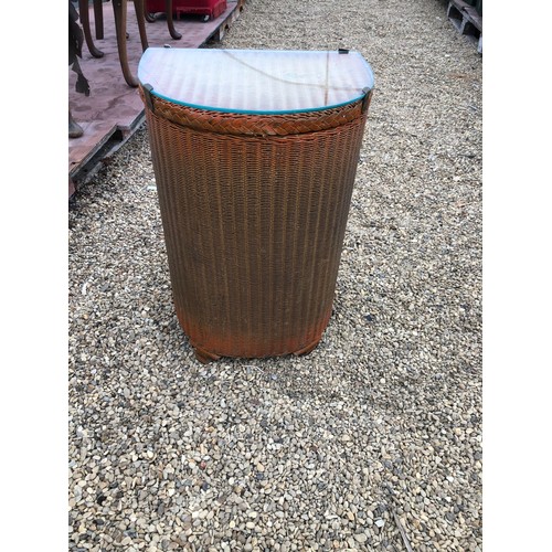 187 - An original Lloyd Loom demi lune Laundry basket with glass protective top and label 