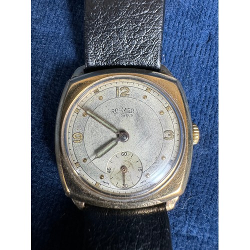 263 - A vintage Gents Roamer wristwatch having a 9 carat case and leather strap.