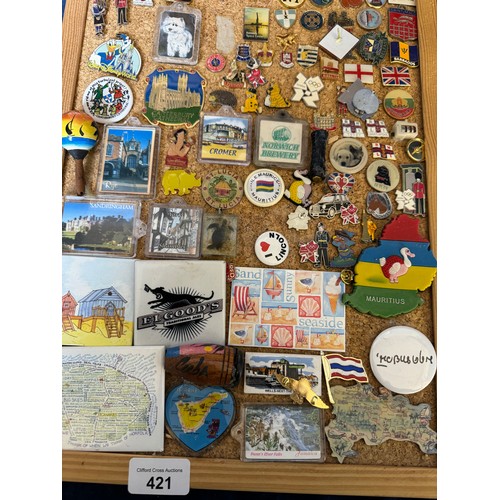 421 - Three cork boards containing a large quantity of pin badges and magnets of various location for UK a... 