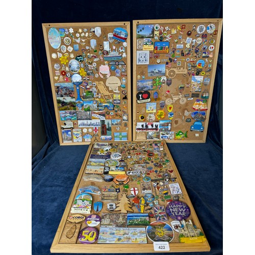 422 - Three cork boards containing a large quantity of pin badges and magnets of various location for UK a... 