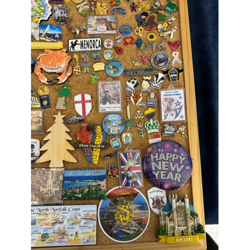 422 - Three cork boards containing a large quantity of pin badges and magnets of various location for UK a... 