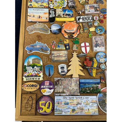 422 - Three cork boards containing a large quantity of pin badges and magnets of various location for UK a... 