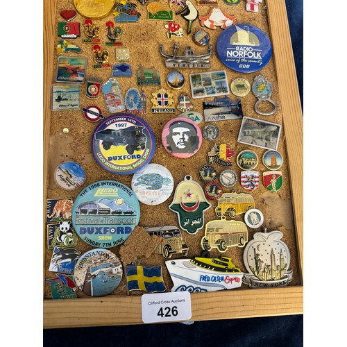 426 - Three cork boards containing a large quantity of pin badges and magnets of various location for UK a... 