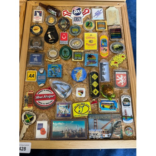 428 - Four cork boards containing a large quantity of pin badges and magnets of various location for UK an... 