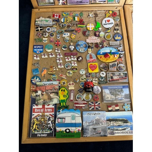 428 - Four cork boards containing a large quantity of pin badges and magnets of various location for UK an... 