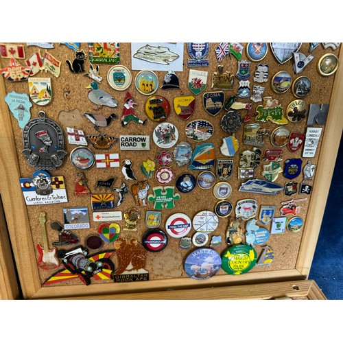 428 - Four cork boards containing a large quantity of pin badges and magnets of various location for UK an... 