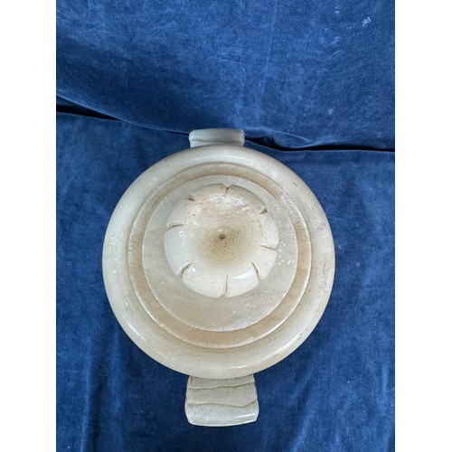 90 - An Alabaster decorative lidded urn with stylised handles and Egyptian figures.