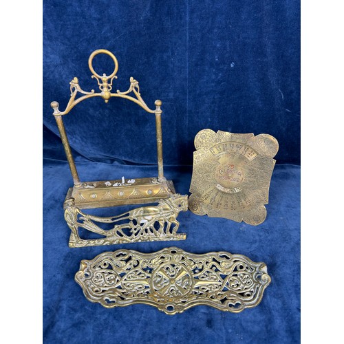 87 - A brass calendar for 1938 - 2012, a pierced brass dish and a brass horse and cart and an ornate Bras... 