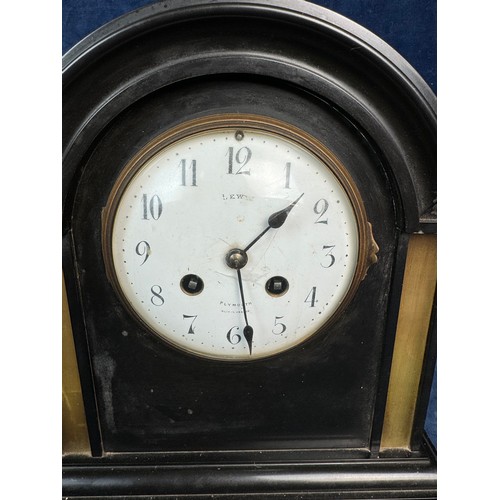 89 - A slate eight day striking dome top mantle clock made by Lewis, Plymouth