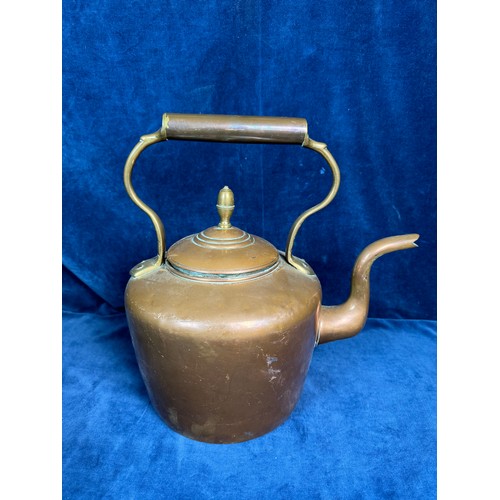 85 - A large copper kettle having acorn finial and oriental marking to base.