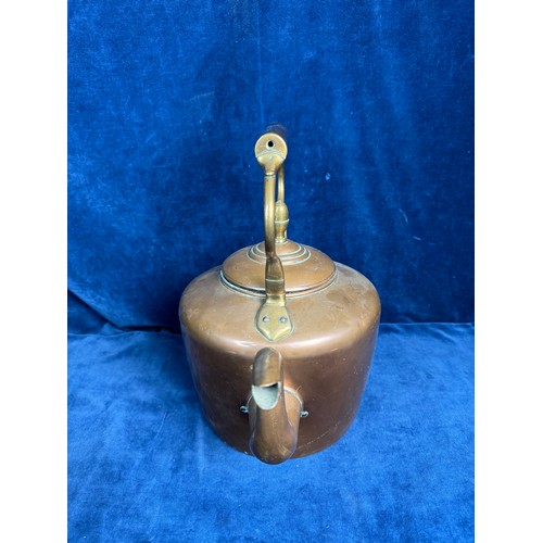 85 - A large copper kettle having acorn finial and oriental marking to base.