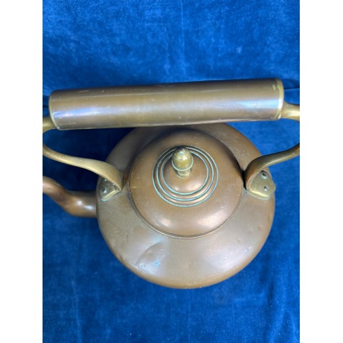 85 - A large copper kettle having acorn finial and oriental marking to base.