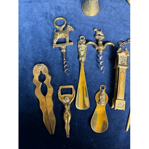 383 - A sundry lot of brassware comprising; mounted horse bell, nutcrackers, corkscrews, shoe horns, etc.,