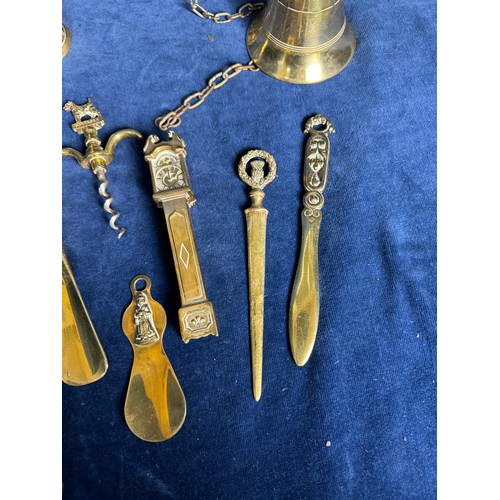 383 - A sundry lot of brassware comprising; mounted horse bell, nutcrackers, corkscrews, shoe horns, etc.,