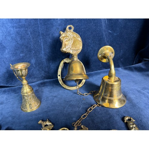 383 - A sundry lot of brassware comprising; mounted horse bell, nutcrackers, corkscrews, shoe horns, etc.,