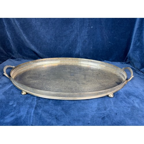 104 - A large oval silver-plate galleried tray.