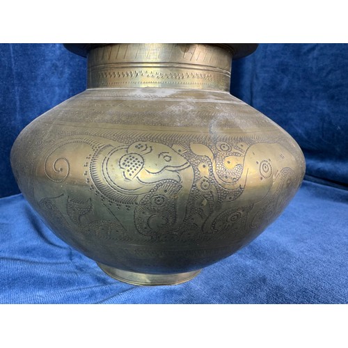 115 - A bronze bulbous design vase having Elephant, Lion and Antelope decoration