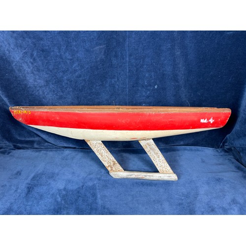 91 - A vintage wooden sailing boat with red and white paint work