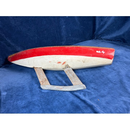 91 - A vintage wooden sailing boat with red and white paint work